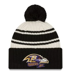 Youth New Era Cream/Black Baltimore Ravens 2022 Sideline Sport Cuffed Pom Knit Hat